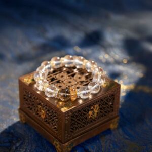 A Capricorn Zodiac crystal bracelet with red lodolite quartz beads.