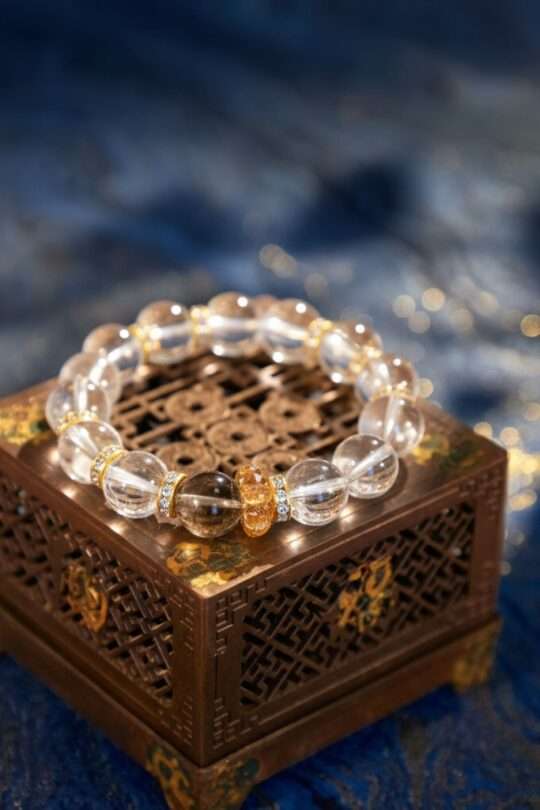 A Capricorn Zodiac crystal bracelet with red lodolite quartz beads.