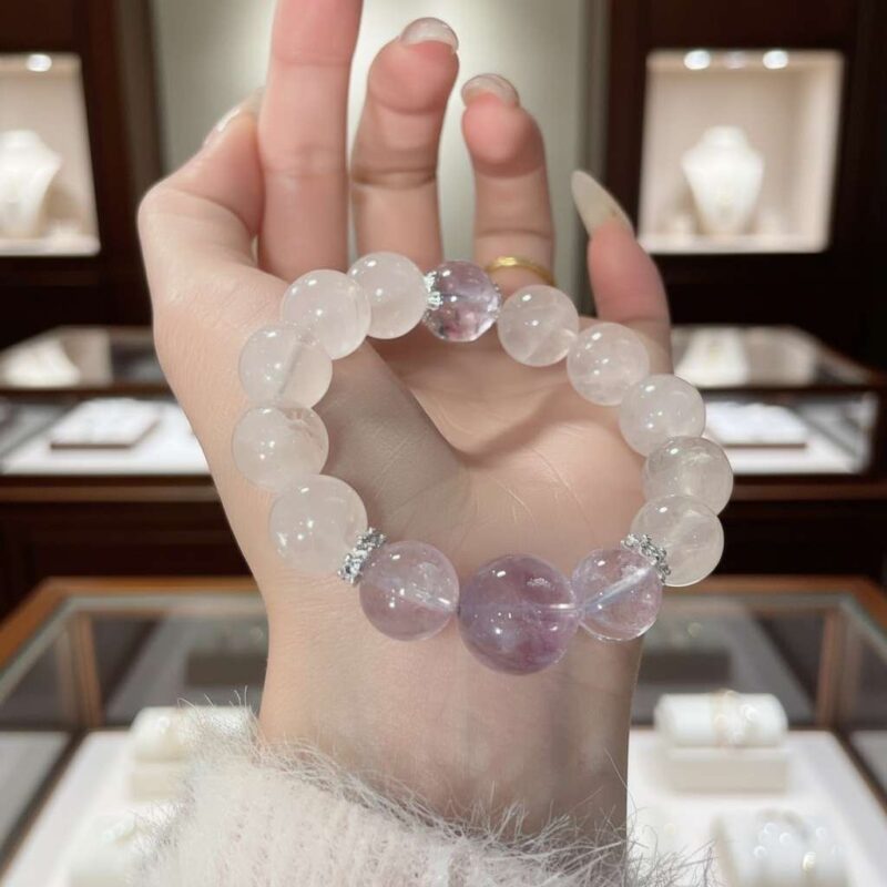 A woman wearing the Pisces Zodiac crystal energy bracelet, showing how it looks on the wrist.