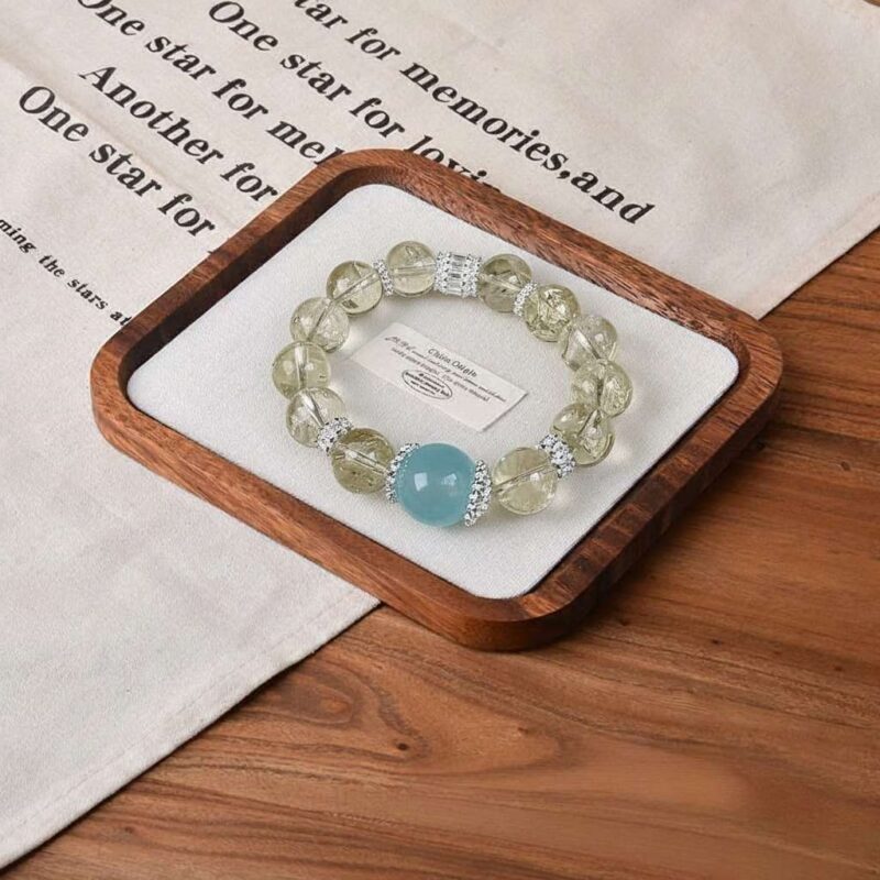 A close-up detail shot of the Blue quartz crystal bead on the Sagittarius Zodiac.