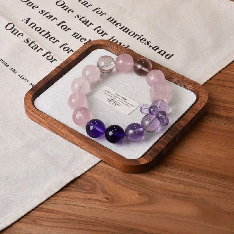 A close-up detail shot of the Amethyst quartz crystal bead on the Scorpio Zodiac.