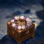 A Scorpio Zodiac crystal bracelet with Amethyst quartz beads.