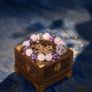 A Scorpio Zodiac crystal bracelet with Amethyst quartz beads.