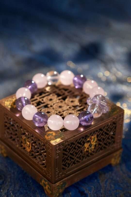 A Scorpio Zodiac crystal bracelet with Amethyst quartz beads.
