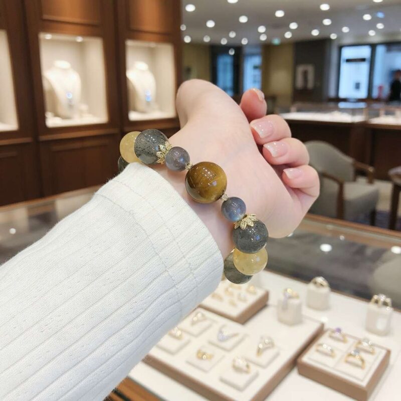 A woman wearing the Chinese Horse Zodiac crystal energy bracelet, showing how it looks on the wrist.