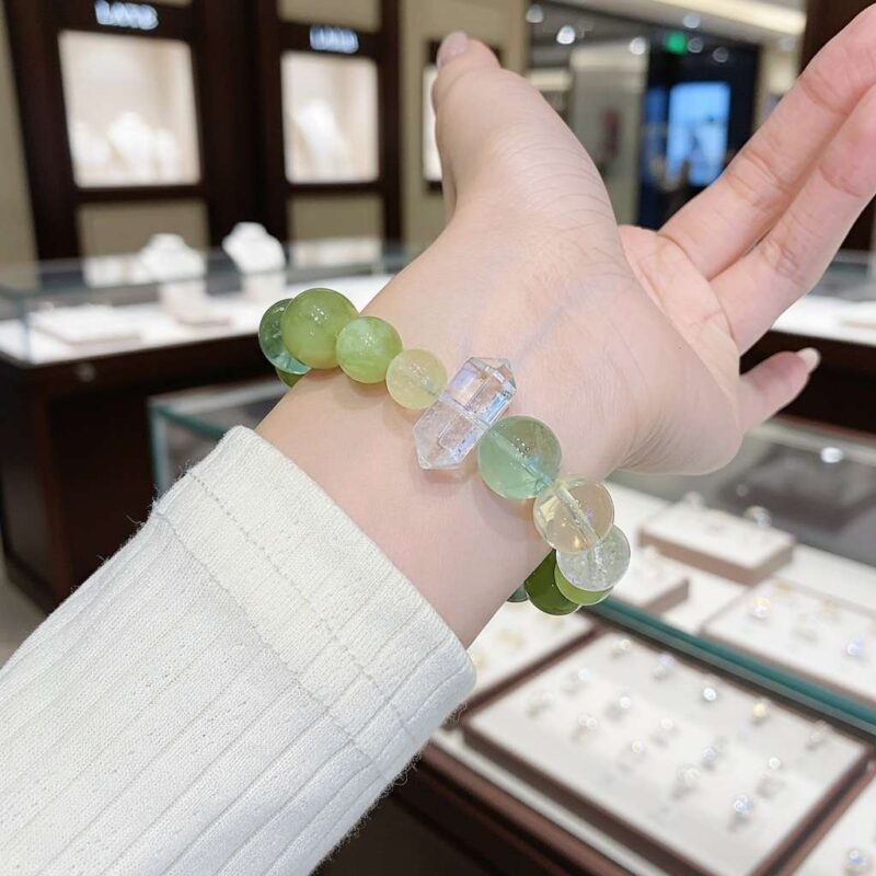 A woman wearing the Chinese Monkey Zodiac crystal energy bracelet, showing how it looks on the wrist.