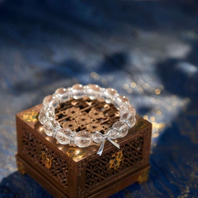 A Chinese Rabbit Zodiac crystal bracelet with green rutilated and phantom quartz beads.