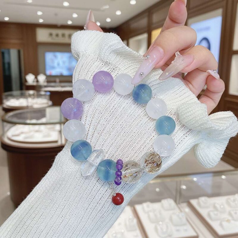 A woman wearing the Chinese Zodiac crystal energy bracelet, showing how it looks on the wrist.