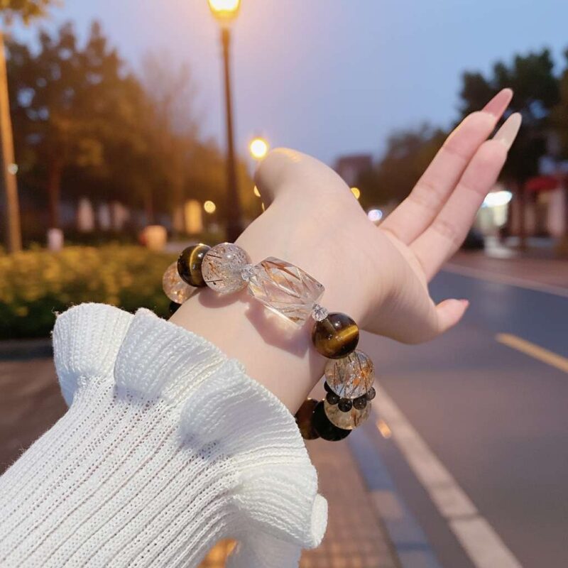 A woman wearing the Chinese Tiger Zodiac crystal energy bracelet, showing how it looks on the wrist.