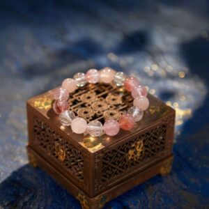 A Ding Fire crystal bracelet with pink and super sevenquartz beads.