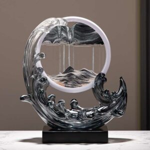 A Feng Shui Moving Sand Art Sandscape in black color on the desk.