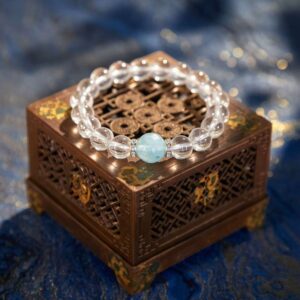 A Gui Water crystal bracelet with white and aquamarine quartz beads.
