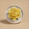 The handmade flower ceramic diffuser shown in a stunning yellow peony color variation.