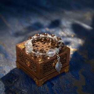 A Wu Earth crystal bracelet with smoky quartz beads.