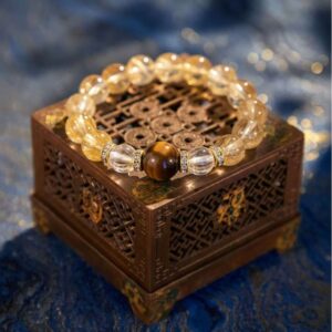 A Xin Metal crystal bracelet with yellow and phantom quartz beads.