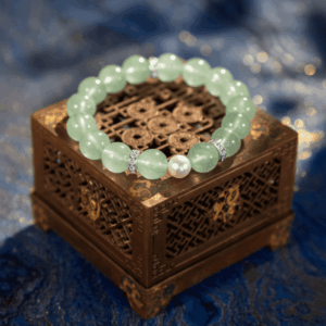A Yi Wood crystal bracelet with green fluorite beads.