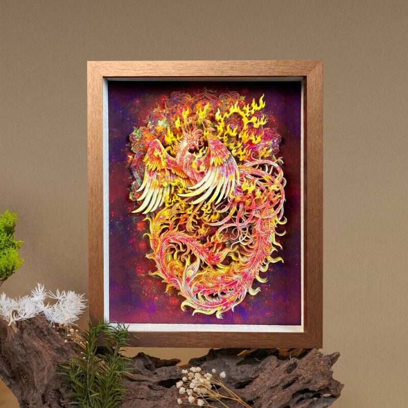 Woman holding a framed 3D Chinese Paper Cutting Fenghuang artwork, showing the colorful Phoenix facing the sun against a walnut wood frame.