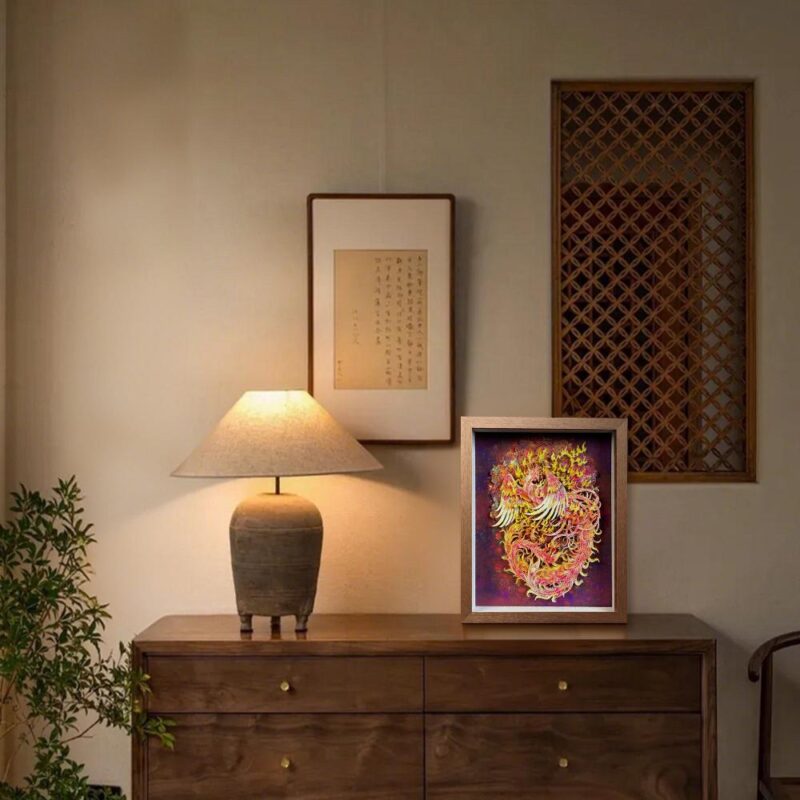 Elegant 3D Chinese Paper Cutting Fenghuang shadow box displayed on a rustic wooden stand, representing harmony and rebirth in Feng Shui decor.