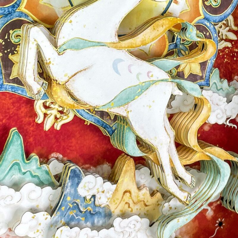 Close up of the Nine-Colored Deer 3D Chinese Paper Cutting showing the multi-layered paper craftsmanship and vibrant Dunhuang fresco colors.