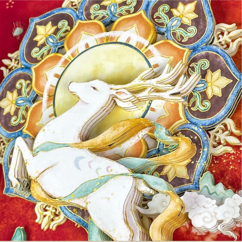 Close up of the Nine-Colored Deer 3D Chinese Paper Cutting showing the multi-layered paper craftsmanship and vibrant Dunhuang fresco colors.