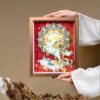 Elegant walnut framed 3D Chinese Paper Cutting artwork placed on a shelf, adding a touch of oriental Zen and Feng Shui fortune to the room.