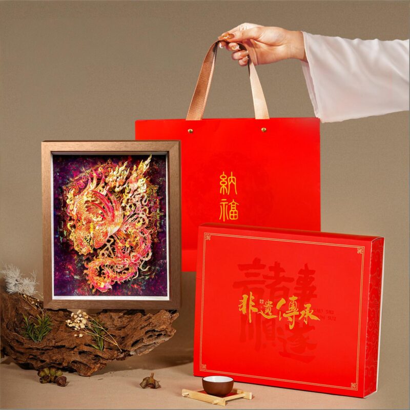 Close up of the 3D Chinese Paper Cutting Vermilion Bird, detailing the laser-carved plumage and the mythical fire symbolism of the Guardian of the South.