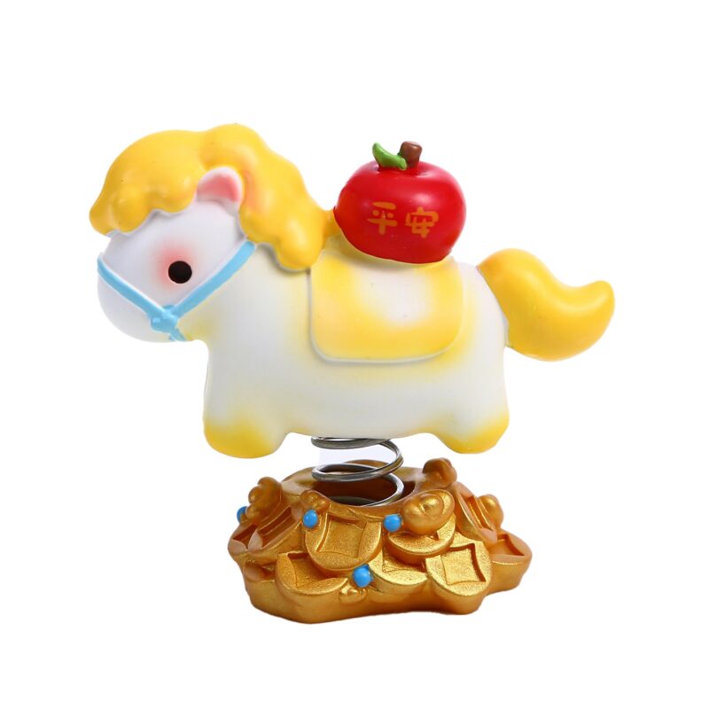 Close up of the Instant Wealth Year of the Horse Creative Spring Ornament with pink hair holding a gold ingot, mounted on a coin base with a spring.