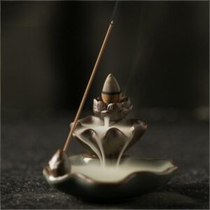 Top view of the Backflow Incense Burner Lotus featuring a brown clay pod and a green crackle-glaze ceramic leaf base.