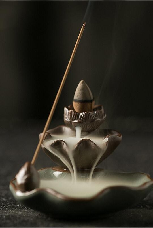 Top view of the Backflow Incense Burner Lotus featuring a brown clay pod and a green crackle-glaze ceramic leaf base.